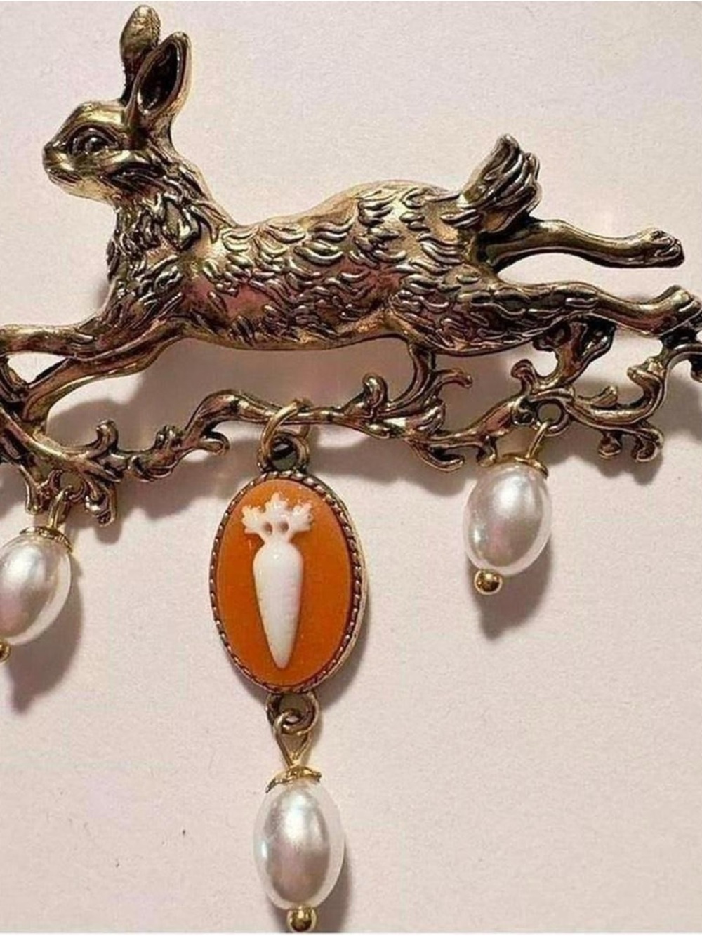 Vintage inspired gold tone leaping rabbit brooch